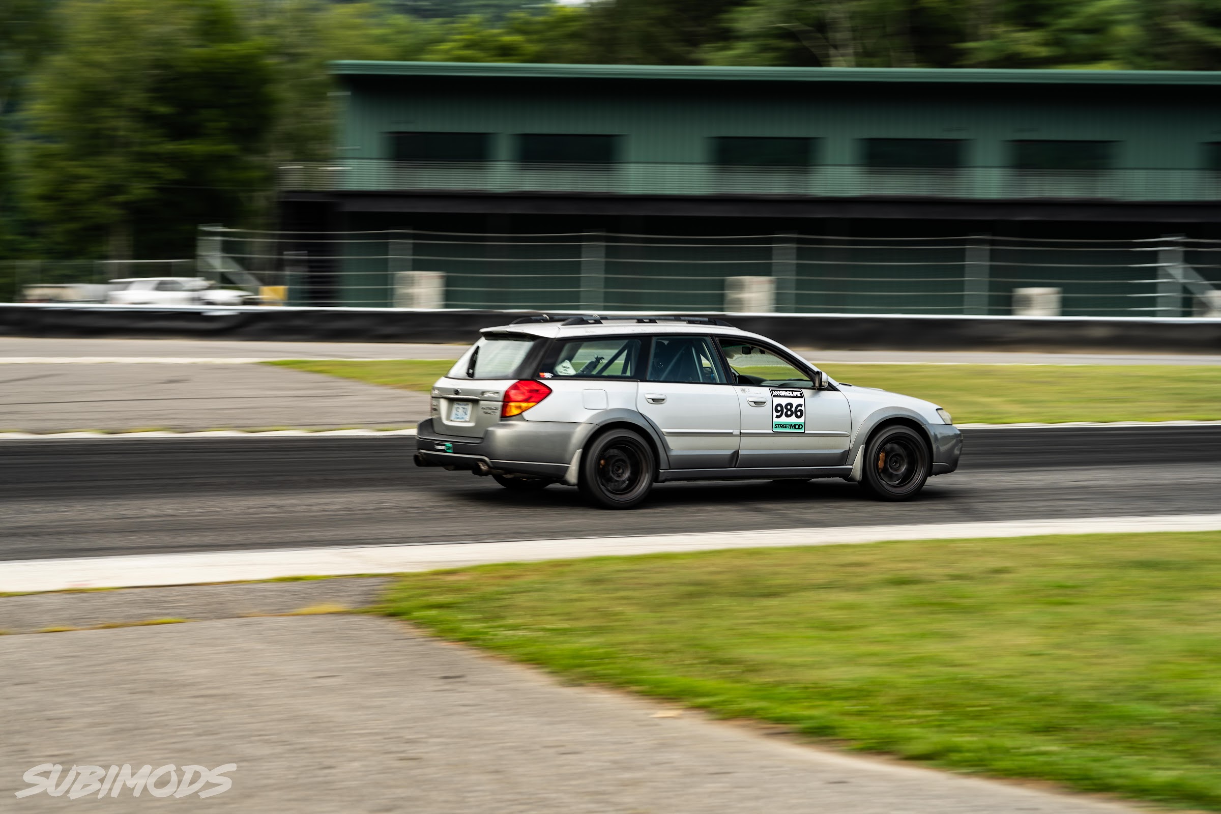 Outback race wagon panned through the Lime Rock esses