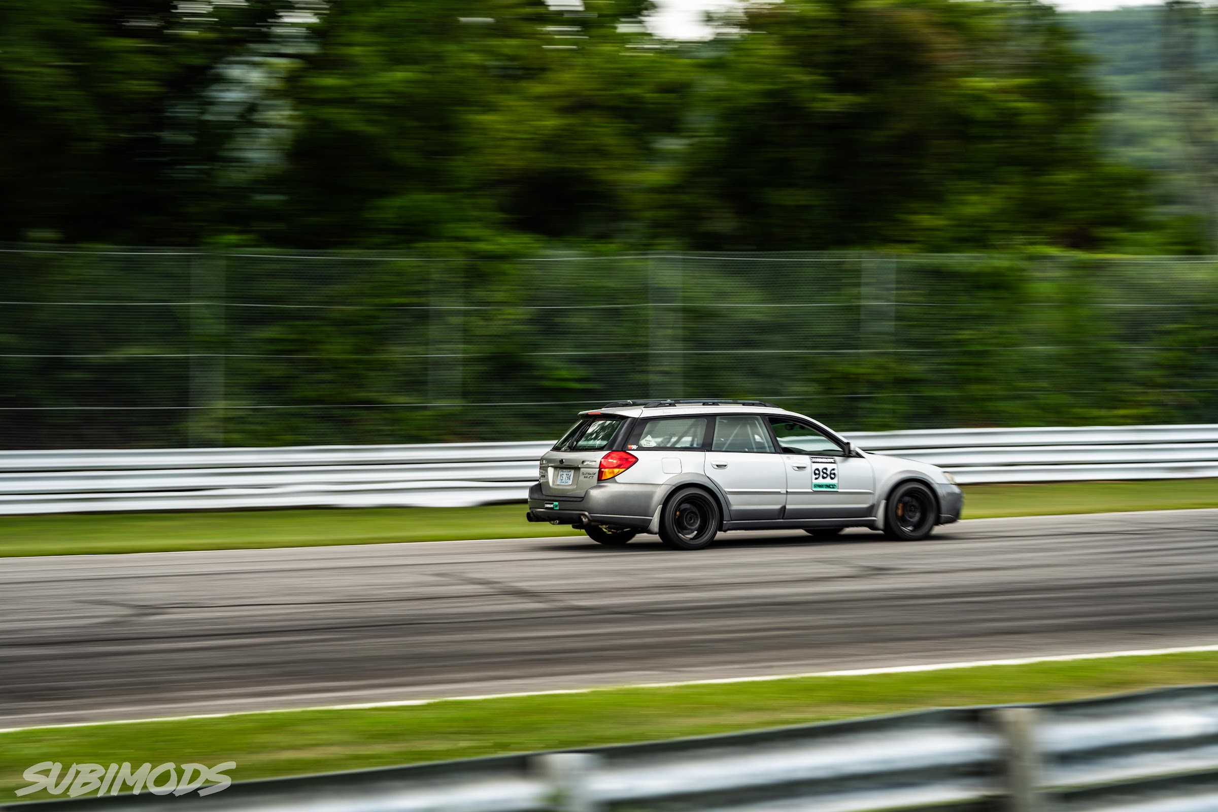 Outback wagon at speed through the guardrail section