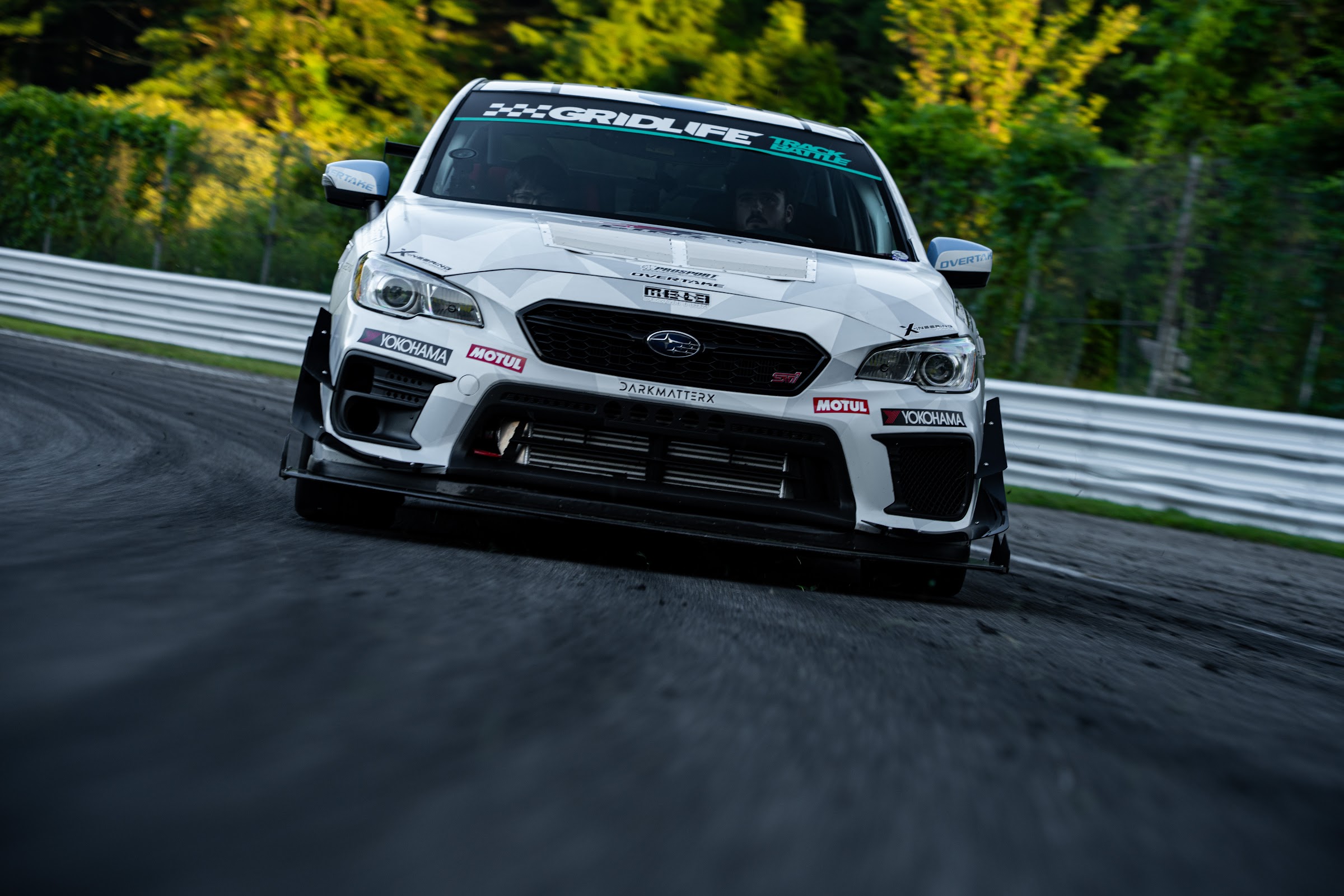 White WRX tracking out of the downhill